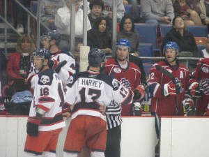 Trevor Gillies exchanging words with Kevin Harvey of the Syracuse Crunch